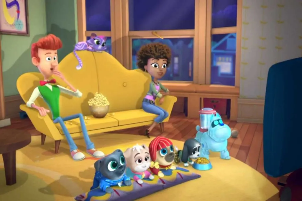 Bob and puppies watching a movie and eating popcorn in Puppy Dog Pals